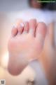 A close up of a person's foot in a bathtub.